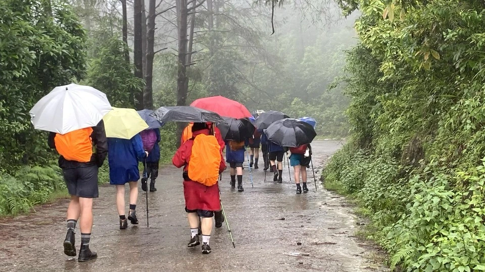 Manson Season - Trekkers on their rain gear 