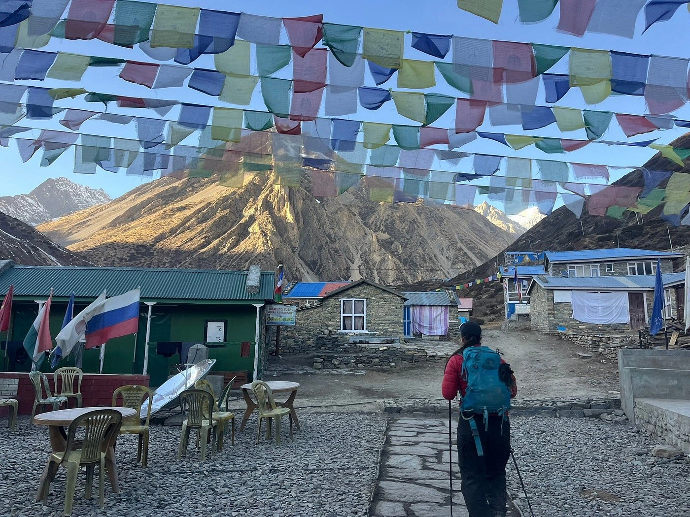 trekkers walking towards yak kharka from manang on annapurna circuit trek trial