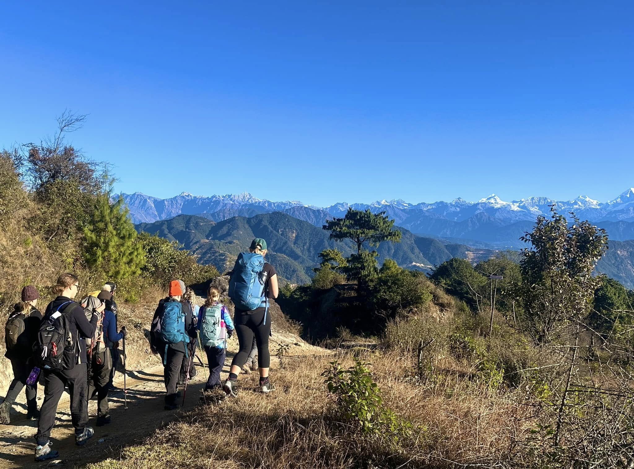 trekkers on their way to kutumsang from chisapani with a clear langtang himal range organized by lhasso adventure and world challange