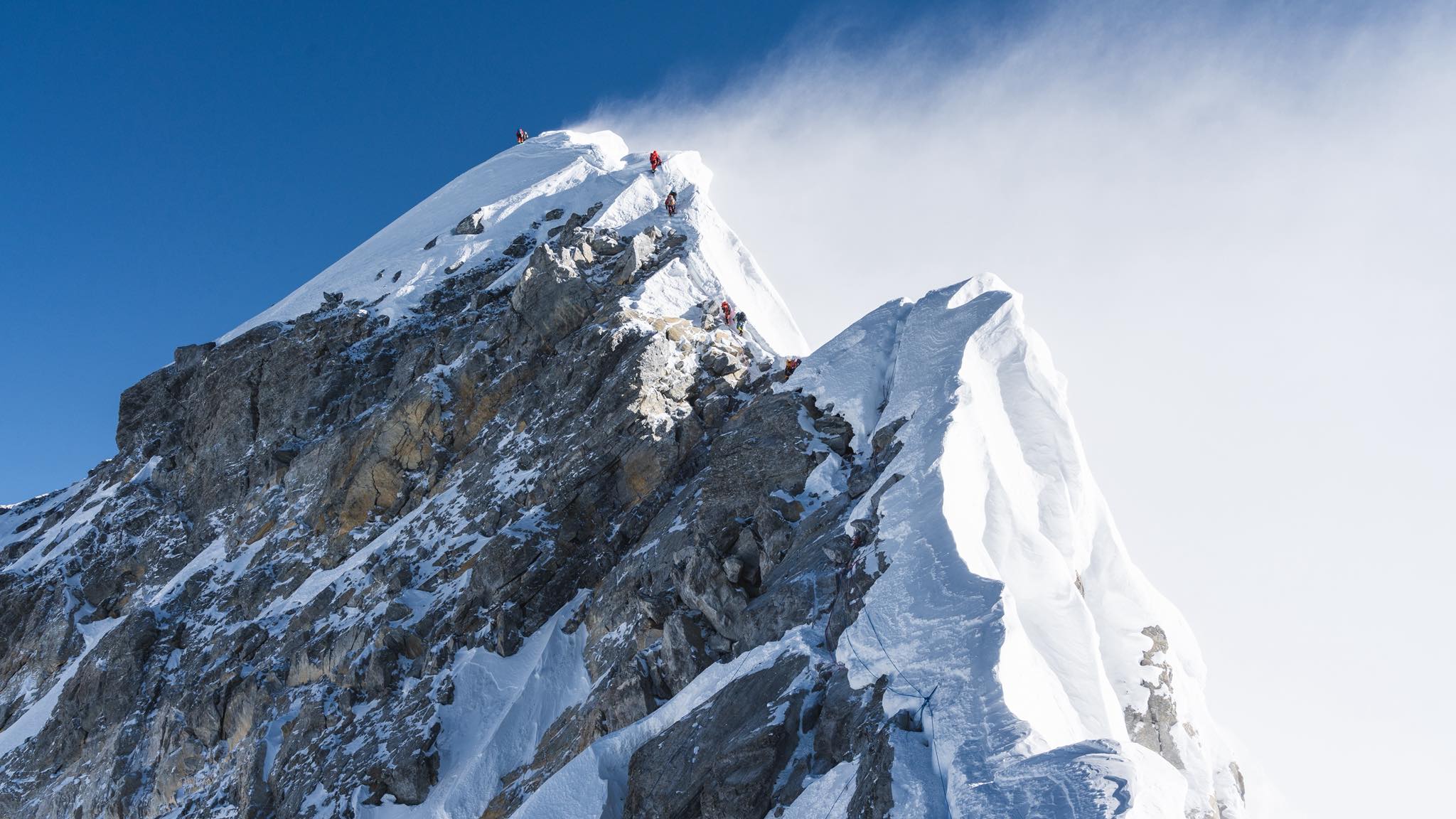 Climbers queuing on the fixed ropes near the summit of Mount Everest during spring season