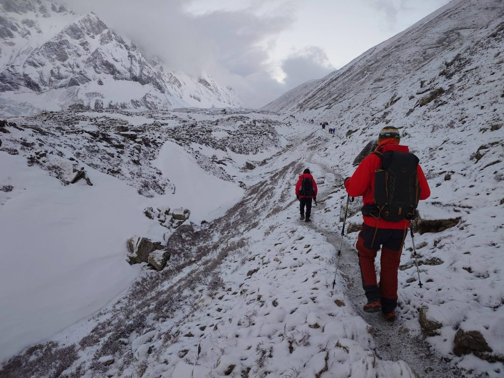 Snow-covered trail approaching Larkya La Pass at Manaslu Circuit Trek