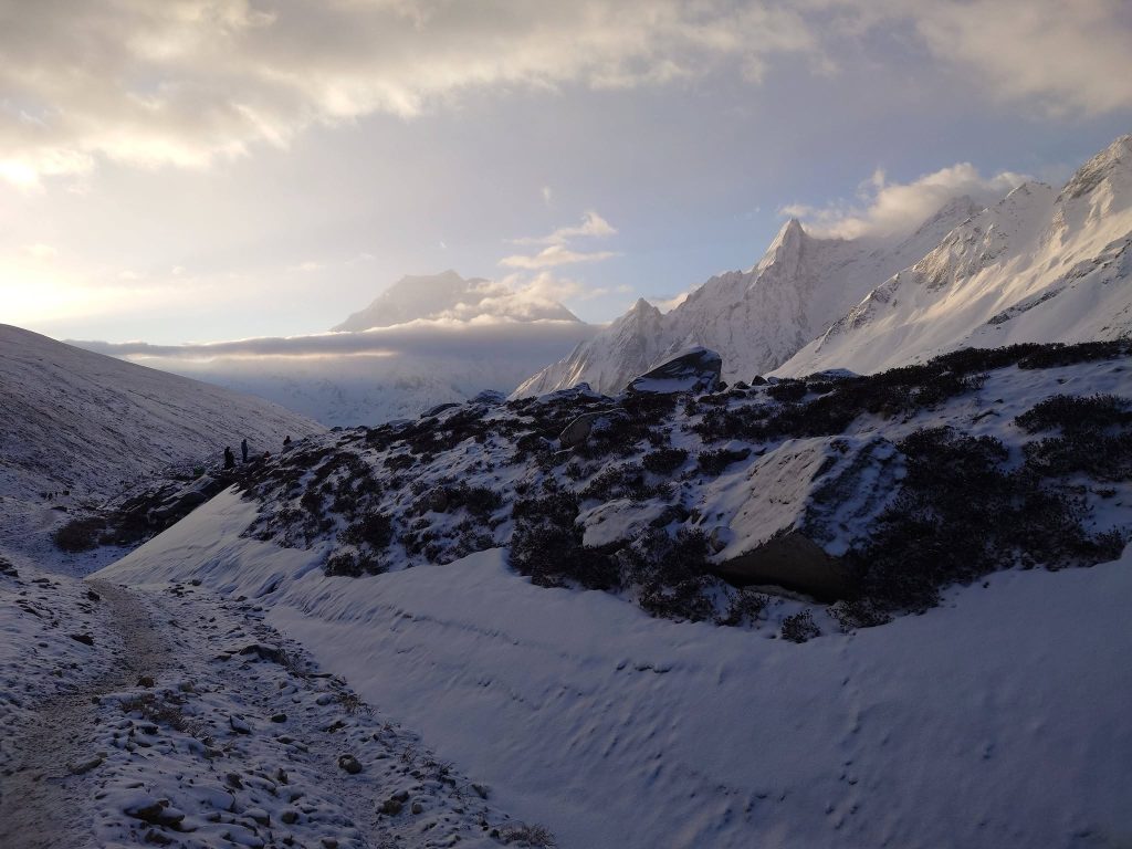 Sunrise view of Larkya La Pass snow-covered ridge on manaslu circuit trek